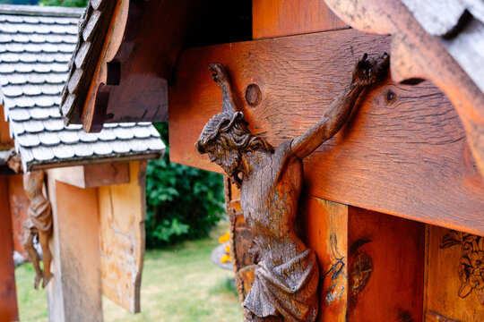 Cemetery in Switzerland with wooden crosses and carvings