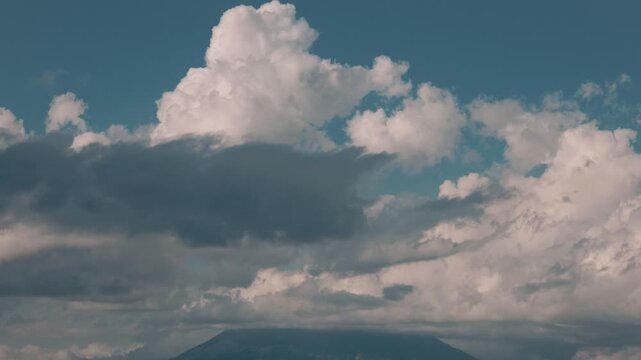 Rising cumulus clouds over Mount Yotei