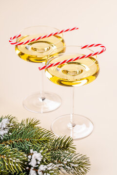 Champagne glasses and snowy fir branches