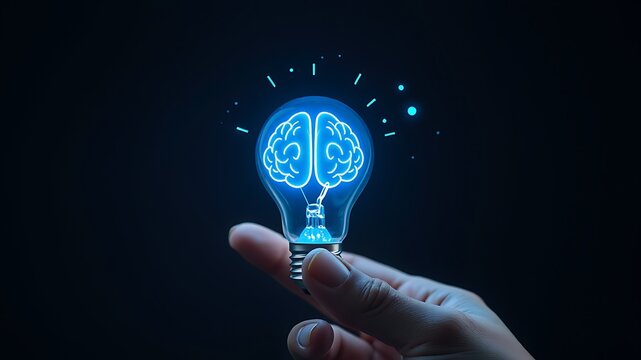 A human hand holding a glowing light bulb with a digital brain inside, representing ideas, intelligence, and innovation concepts