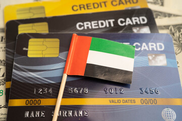 Obraz premium United Arab Emirates flag on credit card, finance economy trading shopping online business.