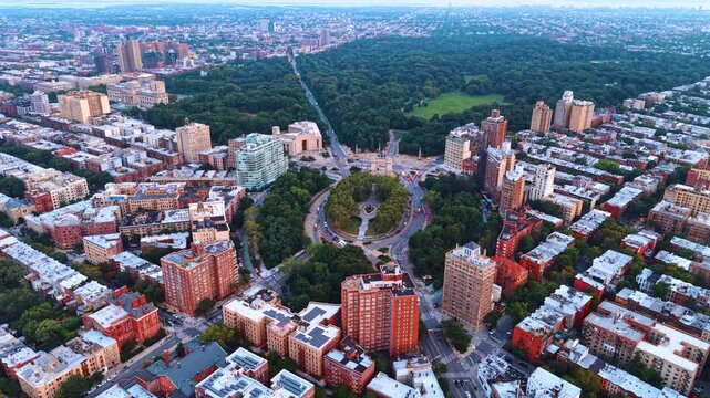 Spot of gorgeous lush greenery in the cement jungle of metropolis. Flight over Grand Army Plaza and Prospect Park in Brooklyn, New York City.