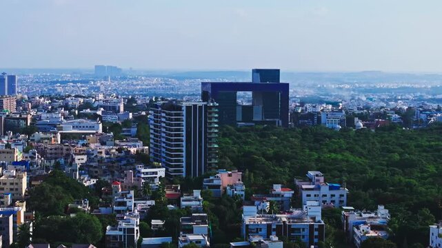 Reveal shot of City Police Commissionerate with one hyd park ultra-luxury residential apartment and kbr park at banjara hills, hyderabad, telangana, india. day time, trucking shot, drone shot, 4k.