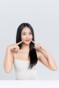 Beautiful young Asian woman with cuteness and beauty face natural makeup isolated on white background, perfectly woman, self care and wellness concept.