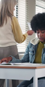 Class, student and frustrated with test results on paper for low grade, exam fail and stress. Education, teacher and upset girl at college for bad quiz score, pressure and disappointed for GPA drop