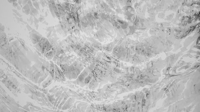 Black and white liquid water ripple texture, abstract swirling marble effect with fluid motion, perfect for motion