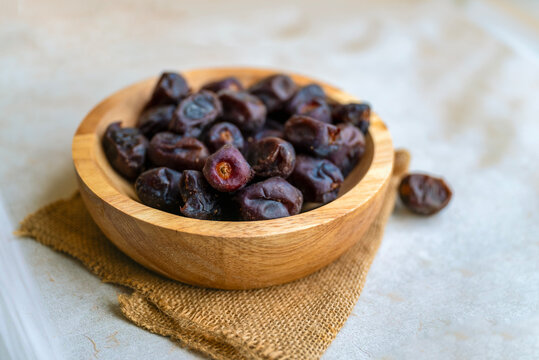 Dry dates in wooden  bowl