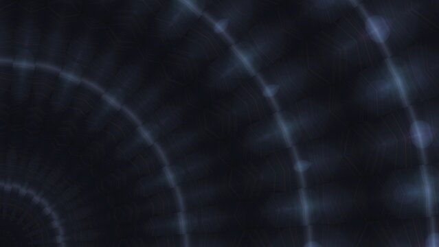 Dark concentric rings spiral inward with glowing blue highlights. Abstract pattern suggests motion