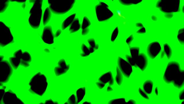Bright green background with randomly scattered black organic shapes creates a vibrant, dynamic visual pattern suitable for creative projects, art, and design.