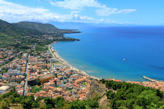Aerial view of a coastal Mediterranean resort town with sandy beaches and blue summer waters resort destination place