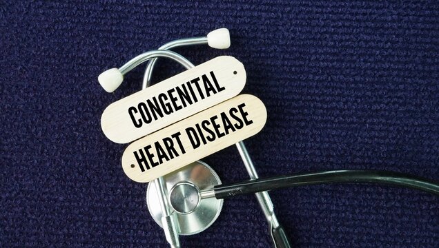 Stethoscope and stick with the word Congenital heart disease. structural problem with the heart that is present at birth.