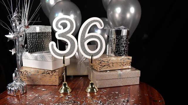 Silver Number 36 with Silver Confetti Glitter Sparkles with Gifts and Balloons and Cupcakes for Party Thirty Six