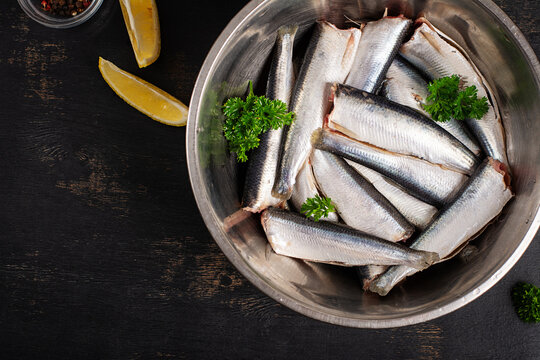 Mediterranean Sardine Recipe Ingredients on Dark Background. Top view