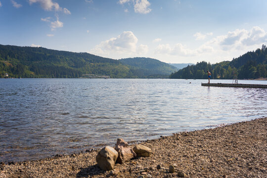 view of Titisee Neustadt Lake in Germany in the mountains of the Black Forest on a sunny summer day