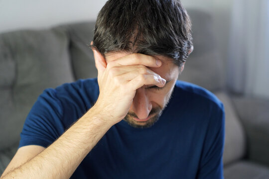 Man holding head suffering from dizziness and labyrinthitis symptom