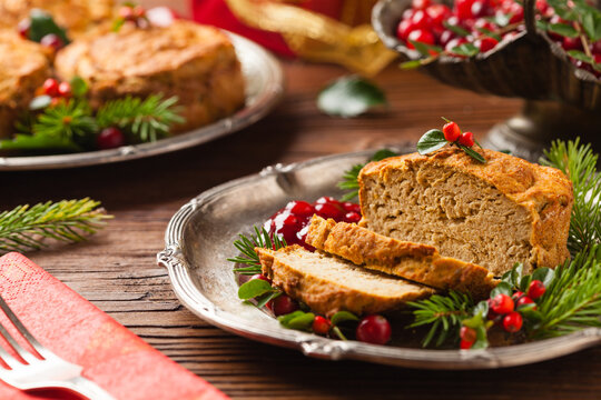 Small, baked patties in Christmas retro styling. Front view. Natural wooden background.