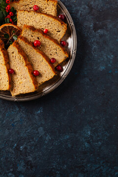 Delicious chicken and pork pate in Christmas decoration. Rustic style. Dark background, metal plates. Top view.