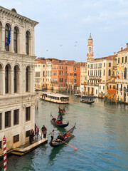 Venice Grand Canal with gondolas, vaporetto and historic Venetian palaces in the heart of Venice, Italy, showcasing iconic architecture, waterways and authentic Italian city life © Polina