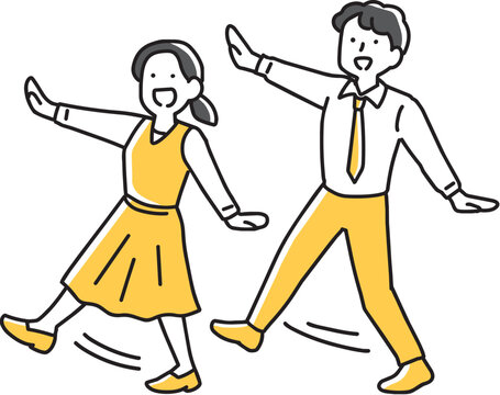 ポーズを取りながら歩く男女