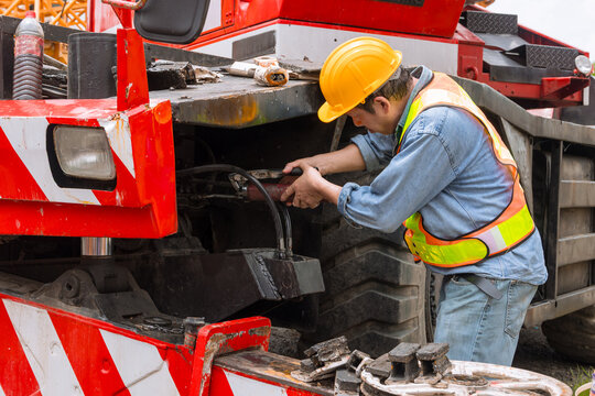 Mechanic Greasing Crane Truck Service Maintenance Heavy Machinery Vehicle Service Technician Repair