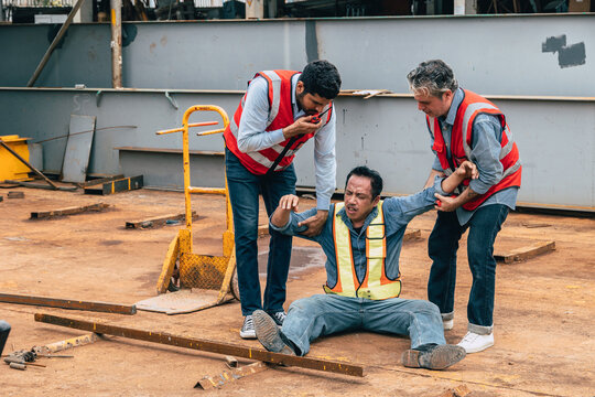 Injured Worker Construction Site Accident Colleagues Helping Emergency Call Walkie Talkie