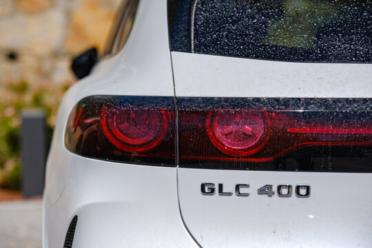 Mercedes-Benz GLC 400 luxury crossover SUV rear tailgate view showing chrome model lettering badge and dusty red LED taillights