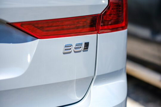 Chrome B5 AWD badge and red taillight detail on the rear tailgate of a modern silver Volvo luxury crossover vehicle