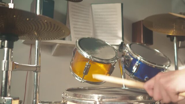 Drum performance featuring rhythm and coordination in a home studio setting