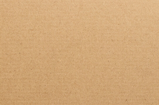 Brown cardboard sheet abstract background, texture of recycle paper box in old vintage pattern for design art work.