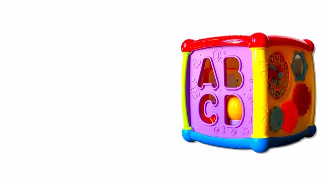 Educational alphabet cube toy with letters A B C D on white background, toddler learning cube.