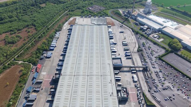 Aerial view of a massive retail supermarket logistics distribution warehouse, trailer yards, and loading bays in Goole, East Riding of Yorkshire, UK.