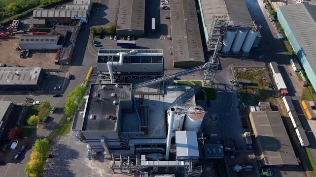Top-down aerial drone view of a modern energy recovery facility and industrial yard in the UK