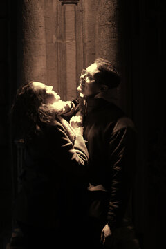 Dramatic Couple Under Mysterious Light in Urban Night Scene