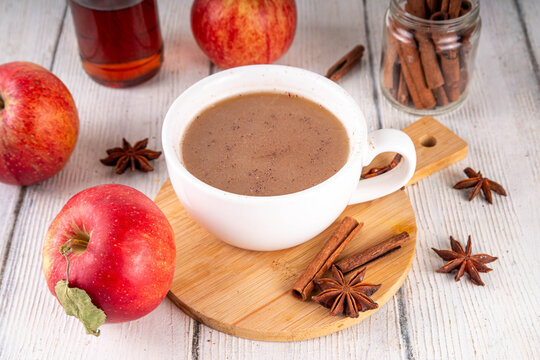Sweet autumn apple spice coffee latte, warm autumn drink with strong coffee, creamer, fall spices - cinnamon, nutmeg, ginger, cloves, tasty cozy warming beverage