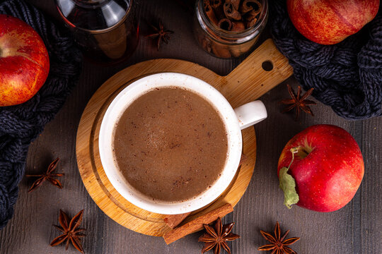 Sweet autumn apple spice coffee latte, warm autumn drink with strong coffee, creamer, fall spices - cinnamon, nutmeg, ginger, cloves, tasty cozy warming beverage