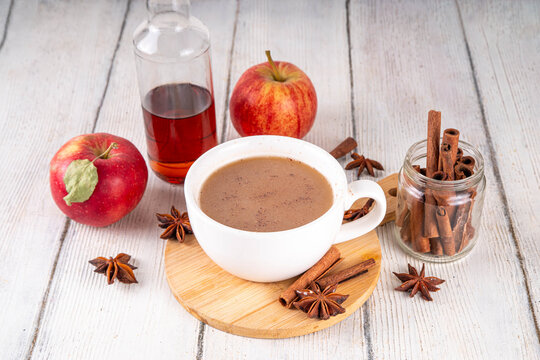 Sweet autumn apple spice coffee latte, warm autumn drink with strong coffee, creamer, fall spices - cinnamon, nutmeg, ginger, cloves, tasty cozy warming beverage