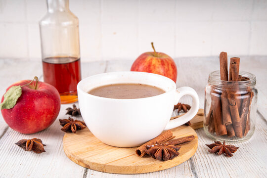 Sweet autumn apple spice coffee latte, warm autumn drink with strong coffee, creamer, fall spices - cinnamon, nutmeg, ginger, cloves, tasty cozy warming beverage