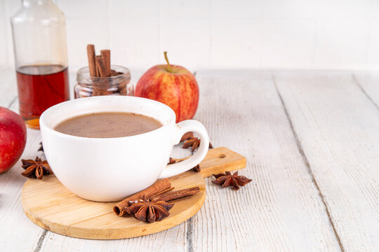 Sweet autumn apple spice coffee latte, warm autumn drink with strong coffee, creamer, fall spices - cinnamon, nutmeg, ginger, cloves, tasty cozy warming beverage