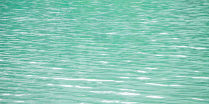 Turquoise water surface texture background for summer travel design mockup