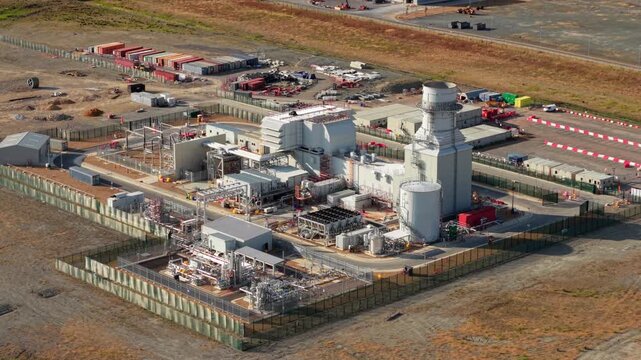 Aerial view of Rookery South ERF and Millbrook Power plant with industrial infrastructure and fenced perimeter in Stewartby, England, United Kingdom.