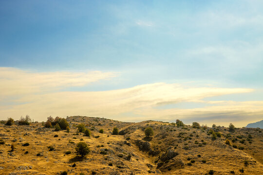 Golden Karst Mountain Landscape Under Blue Sky in Bjelasnica, Bosnia and Herzegovina