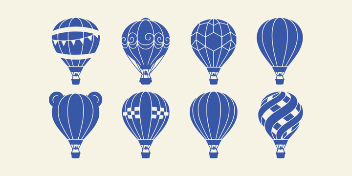 Set of blue hot air balloons isolated on a cream background