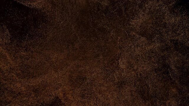 Abstract dark brown and black textured surface backdrop.