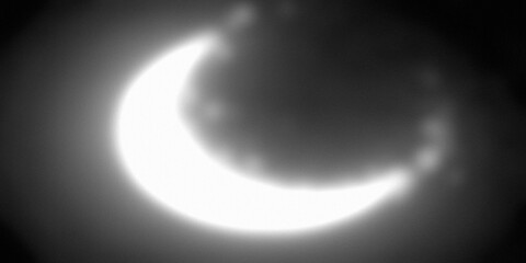 A stunning crescent moon illuminated by the soft glow of a distant star in a dark night sky © Mahebul
