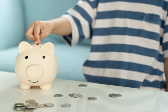 Save money. children putting coin for saving. wealth, Finance, insurance, investment, education, future, plan life, learn, banking, family, health, health and accident insurance.