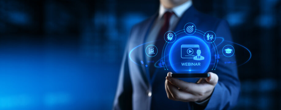 Businessman Holding Smartphone with Webinar Icons on Screen. E-learning and Education Concept
