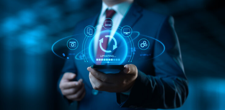 Businessman Holding Device with Update Icons on Screen. Software Updating or Upgrade Concept
