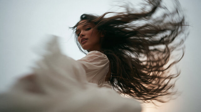 Beautiful Woman Spinning with Long Flowing Hair Outdoors