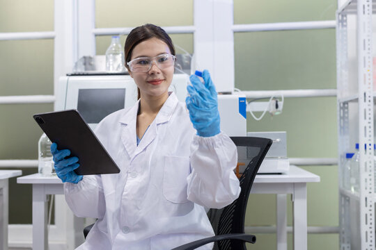Laboratory technician conducts experiments with test tubes in a modern research facility