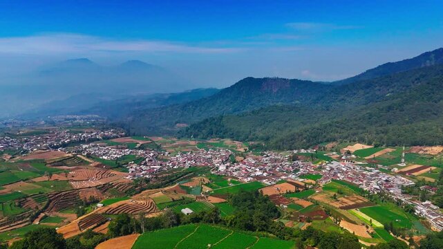 Aerial view of Brakseng in the lush terraced fields of Batu, East Java, Indonesia.